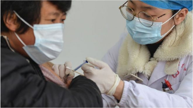 A medical worker vaccinates a rural resident at a COVID-19 vaccination site at the township level in Fuyang.