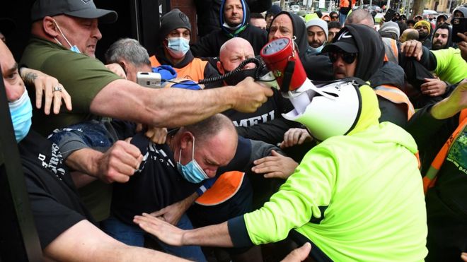 Construction workers clash with industry union members at a protest at Construction, Forestry, Maritime, Mining and Energy Union (CFMEU) headquarters in Melbourne