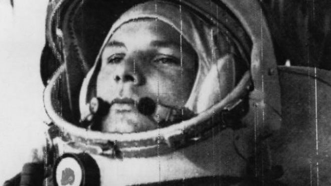 Yuri Gagarin wearing a space helmet