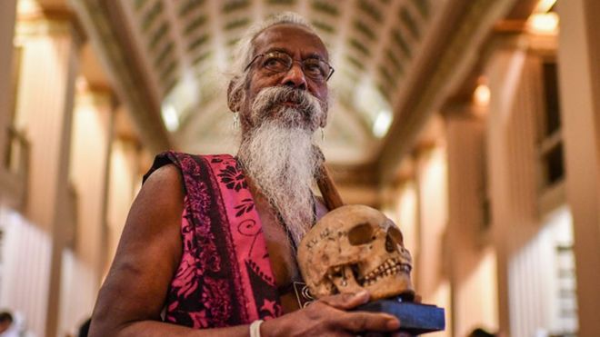 Vedda chief Wanniya Uruwarige with skull