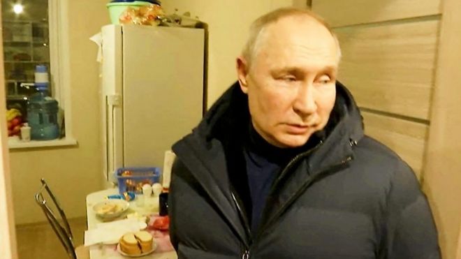 Russian President Putin in a kitchen in Mariupol