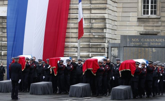 French Police officers carry coffins during a ceremony to pay tribute to the victims of the 03 October knife attack in Paris" Police headquarters, in Paris, France, 08 October 2019
