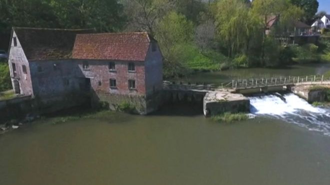 1,000-year-old mill starts up again to keep families supplied with flour
