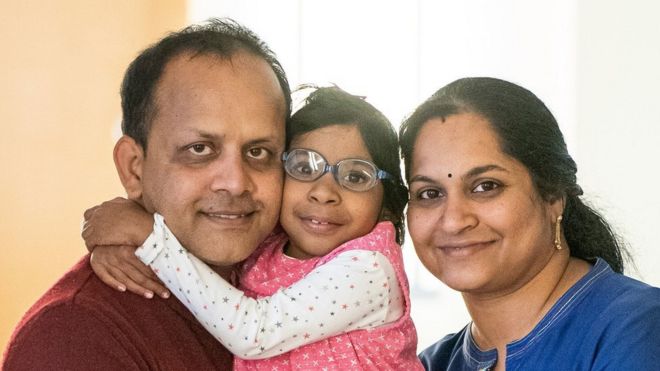 Aditi, eight, with father Uday and mother Schimke