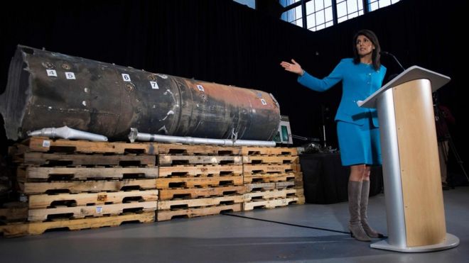Nikki Haley gestures towards the remnants of a ballistic missile that came close to hitting Riyadh's airport in November, at Joint Base Anacostia in Washington on 14 December 2017