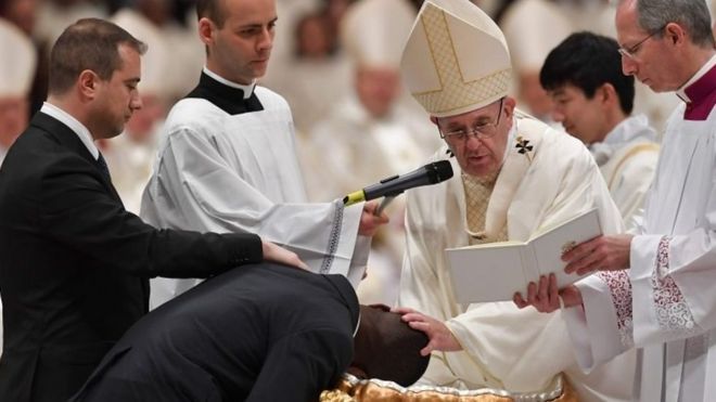 Pope Francis baptises Nigerian former beggar John Ogah at St Peter's Basilica