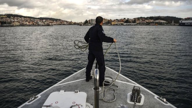 The Greek coast guard arrives at the port of Mytilene after patrolling on the Mediterranean sea between the Greek island of Lesbos and Turkey, 19 March 2019