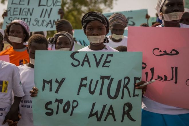Women from more than forty South Sudanese womens organizations carry placards as march through the city to express the frustration and suffering that women and children face in Juba, South Sudan on December 9, 2017.