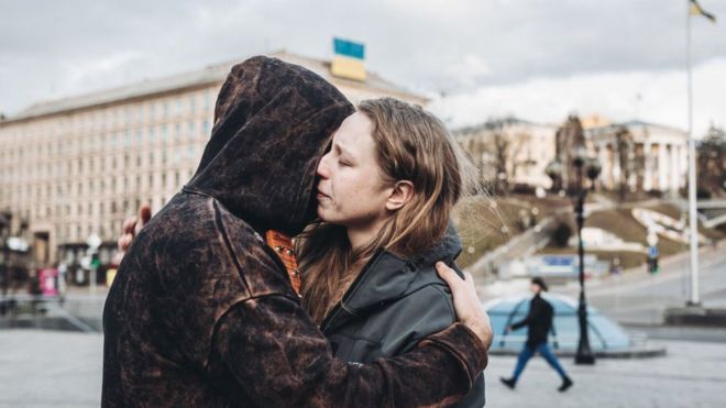 A couple embrace in Maidan Square, Kyiv on day three of Russia's invasion of Ukraine