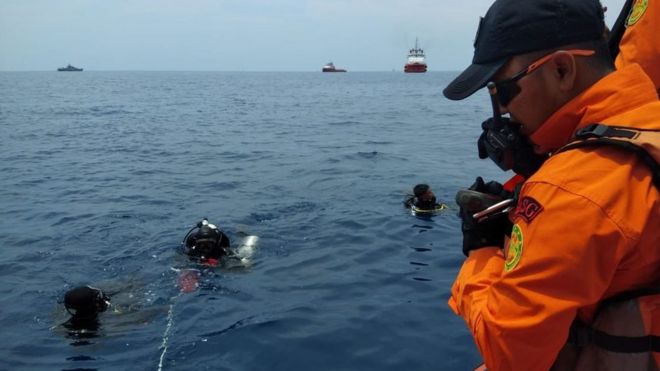 Divers at the crash site off Jakarta, Indonesia