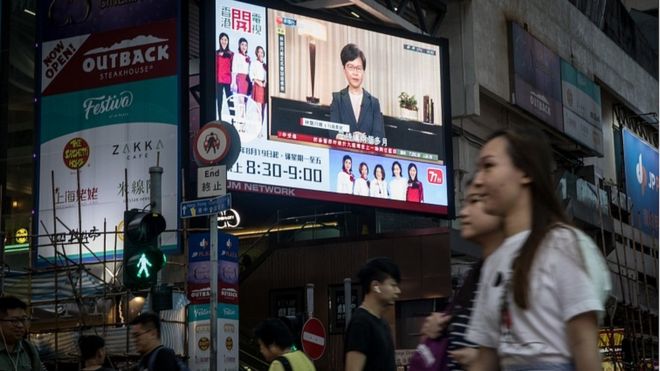 Carrie Lam broadcast seen on the streets of Hong Kong. 4 Sept 2019