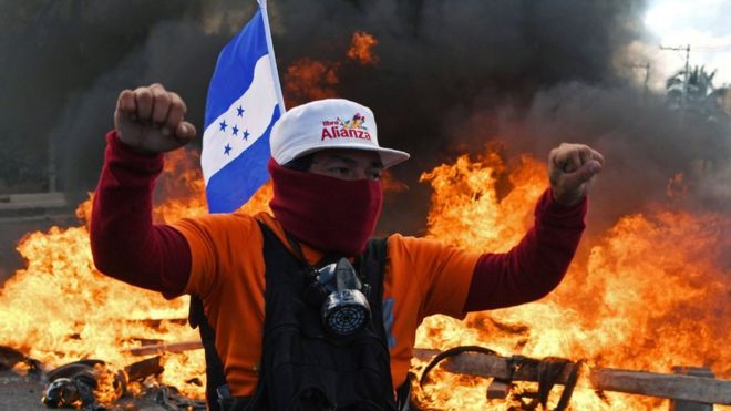 Honduran Opposition Alliance Against the Dictatorship supporter protest among barricades against president Juan Orlando Hernandez reelection, while the inauguration ceremony takes place at the Tiburcio Carias Andino national stadium, in Tegucigalpa, on January 27, 2018.