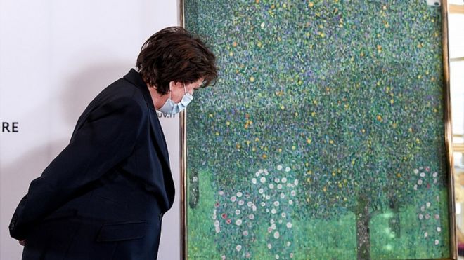 French Culture Minister Roselyne Bachelot stands next to the painting Rose Bushes under the Trees by Austrian painter Gustav Klimt, at the Musee d'Orsay in Paris, France March 15, 2021