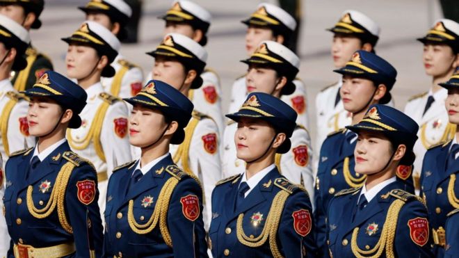 Chinese honour guard arrive for the welcoming ceremony for French President Emmanuel Macron and China's President Xi Jinping in Beijing on April 6, 2023.