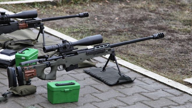 Two sniper rifles at a shooting range