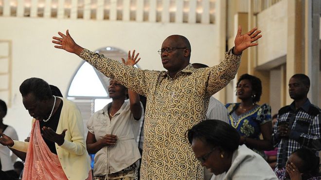 People pray in a Kigali church on April 6, 2014