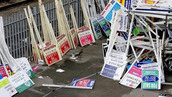 For sale signs on ground