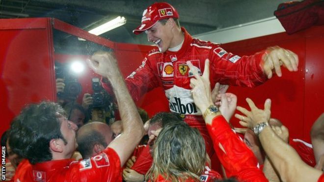 Michael Schumacher celebrates his sixth world title in 2003