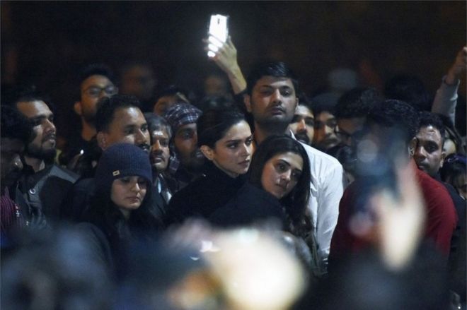 In this photo taken on January 7, 2020, Bollywood actress Deepika Padukone (C) visits students protesting at Jawaharlal Nehru University (JNU) against a recent attack at JNU on students and teachers in New Delhi