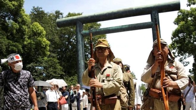 Men dressed as Japanese soldiers at the Yasukuni Shrine in Tokyo