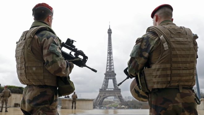 French soldiers on patrol near the Eiffel Tower in Paris, 30 March