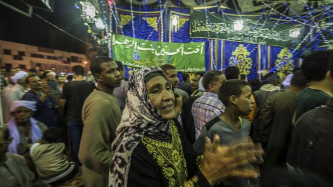 Egyptians perform Sufi rituals outside Cairo's Sayeda Zainab mosque, May 2015