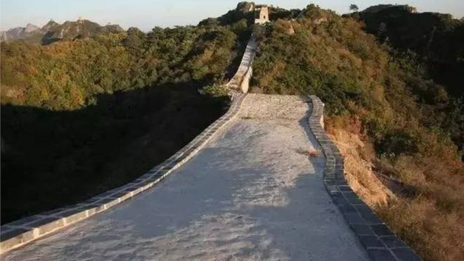 Great Wall of China damaged by workers with an excavator