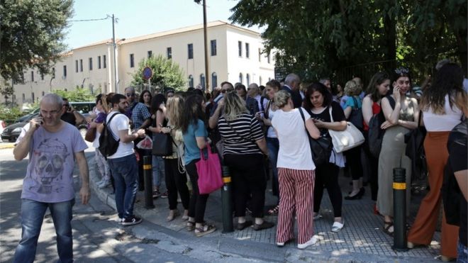 Citizens gather in an open area following an earthquake