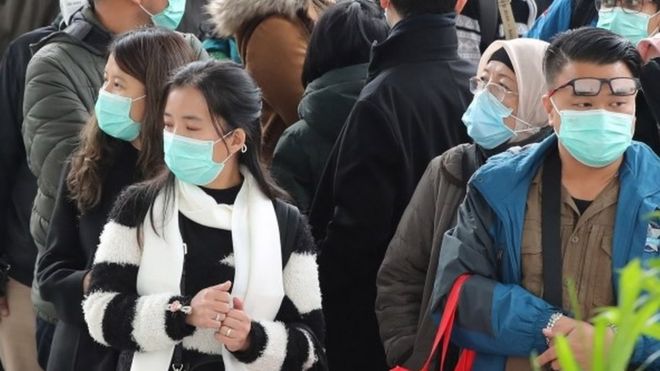 People wear masks in Seoul, South Korea. Photo: 21 February 2020