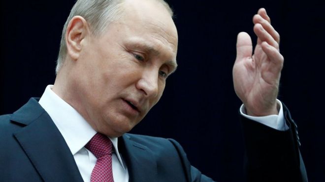 Russian President Vladimir Putin gestures as he speaks to journalists following a live nationwide broadcast call-in in Moscow, 15 June