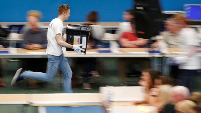 A ballot box is rushed into the counting centre for Britain's general election in Sunderland, 8 June 2017.
