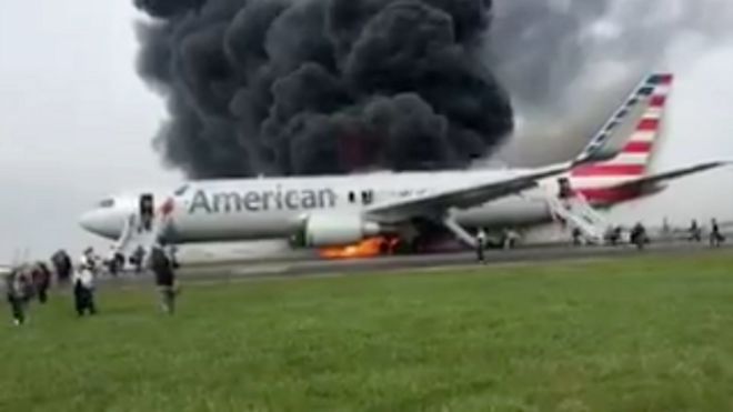 An image taken from a video filmed by a passenger who fled an American Airlines plane after it caught fire at Chicago's O'Hare airport - 28 October 2016