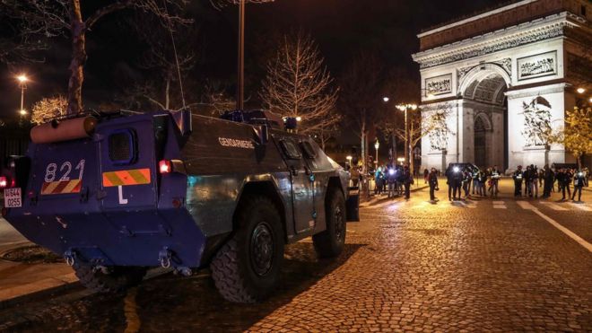 Armoured vehicle near the Arc de Triomphe in central Paris - 8 December