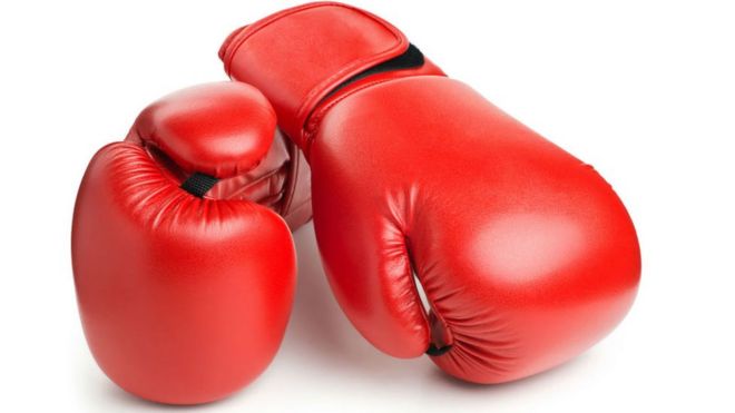A pair of red boxing gloves