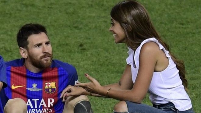 Lionel Messi joined on the pitch by Antonella Roccuzzo and their two sons