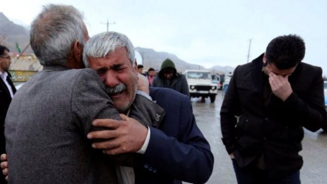 Relatives of passengers who are feared to have been killed in a plane crash react near the town of Semirom, Iran. Photo: 18 February 2018