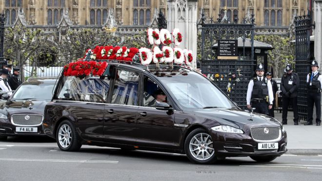 The hearse leaving the Houses of Parliament