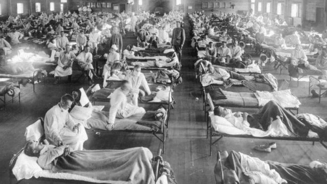 In this 1918 photograph, influenza victims crowd into an emergency hospital at Camp Funston, a subdivision of Fort Riley in Kansas