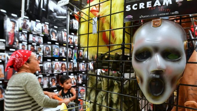 A mask from the TV series 'Scream' is displayed at a store selling Halloween merchandise in Alhambra, California