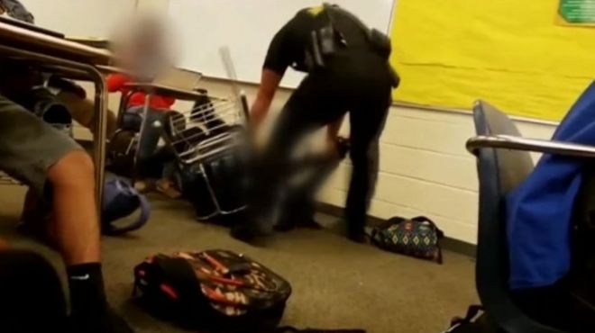 Officer drags student across classroom