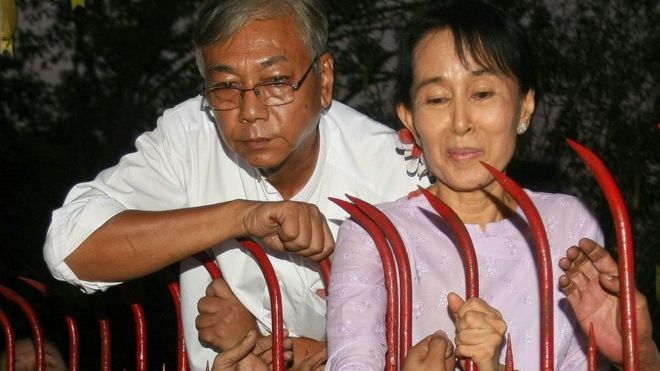 In this file picture taken on 13 November 2010, Htin Kyaw (L), a senior National League for Democracy (NLD) official stands next to Aung San Suu Kyi (R) at her residence on the day of her release from house arrest in Yangon where she was detained for nearly two decades