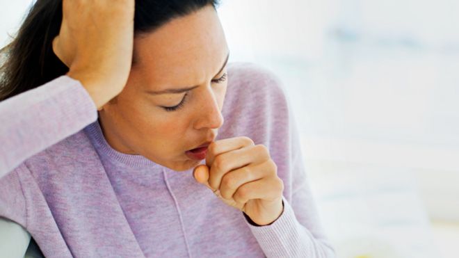 Woman coughing