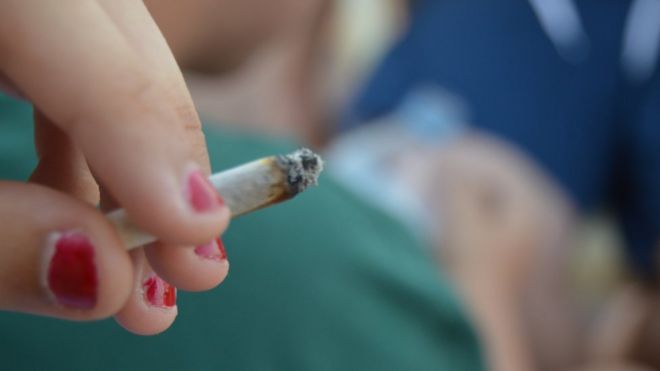 A teenager smoking cannabis