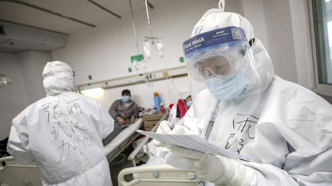 A medical worker in protective suit