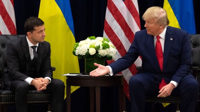 US President Donald Trump offers a hand to Ukrainian President Volodymyr Zelensky during a meeting in New York, 25 September 2019