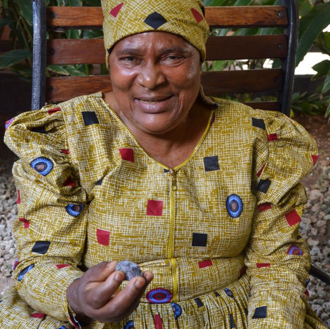 Pili Hussein pictured with a piece of tanzanite