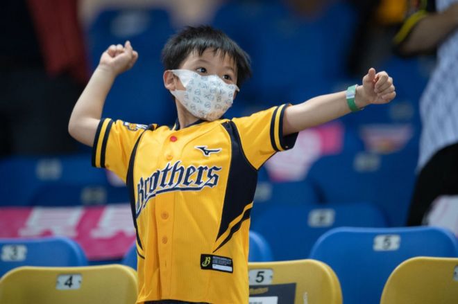 Young fans reacts to a score during the CPBL game between CTBC Brothers and Rakuten Monkeys at the Taichung Intercontinental Baseball Stadium on May 10, 2020 in Taichung, Taiwan.