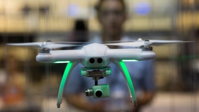 An exhibitor flies a drone during the spring edition of the Hong Kong Electronics Fair in Hong Kong, China, 13 April 2016.