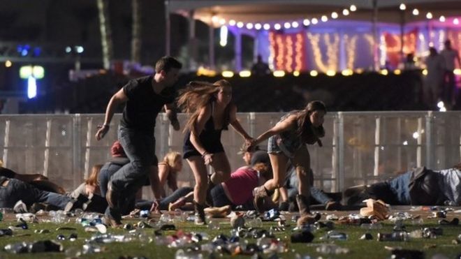 People run from the Route 91 Harvest country music festival after apparent gun fire was heard on October 1, 2017 in Las Vegas