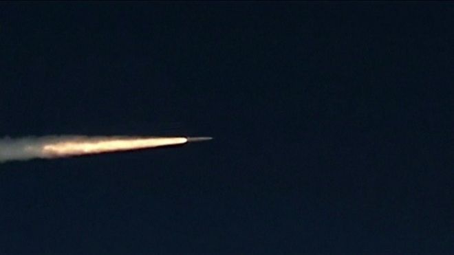 missile with streak of light behind it